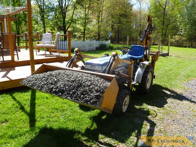DIY - Palram Greenhouse Project | carrying a load of stone. palram 6 x 10 greenhouse project