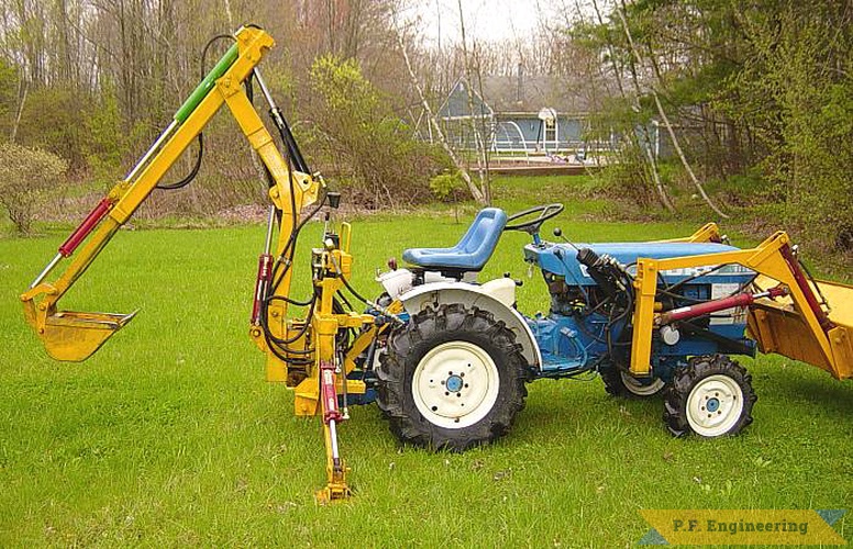 the boom has been modified for an extend-a-hoe option that provides 7.5 feet digging. see my video on this site for action footage. | Ford 1110 compact tractor Micro Hoe_2